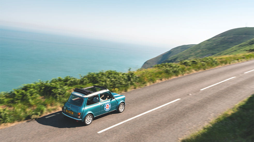 Classic Mini road trip Mini driving cliff edge